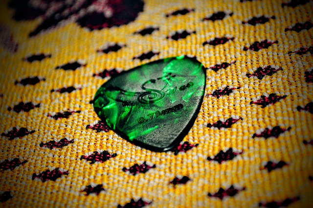 guitar pick, plectrum, green